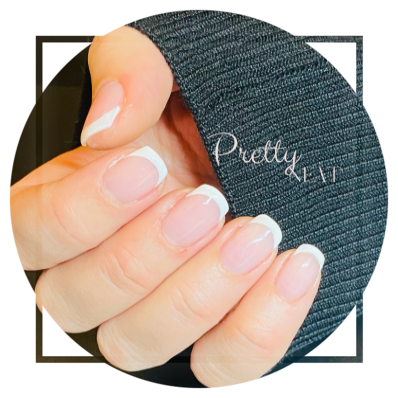 Right hand with cardigan sleeve showing Clear coated nails Clear coated nails